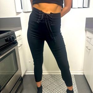 black leggings with corset belt attachment